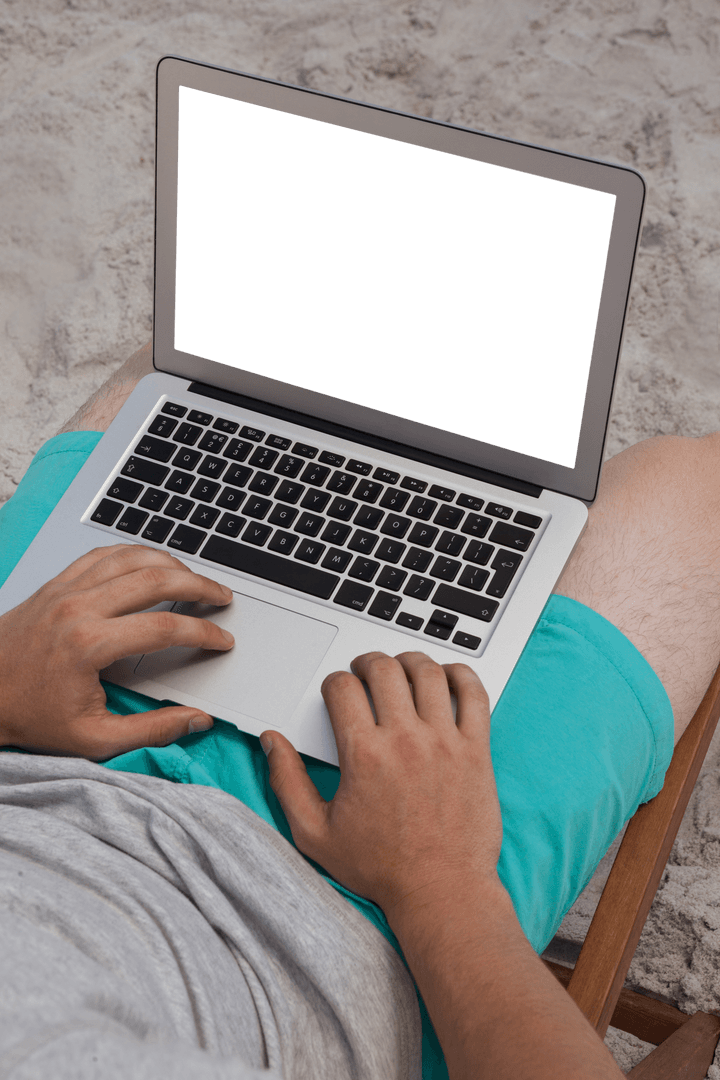 Transparent Laptop Usage on Sandy Beachlines in Vibrant Attire