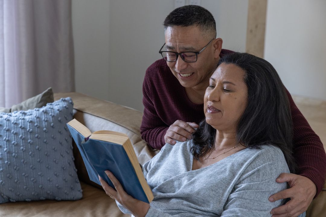 Loving Couple Enjoying Reading in Cozy Home Setting