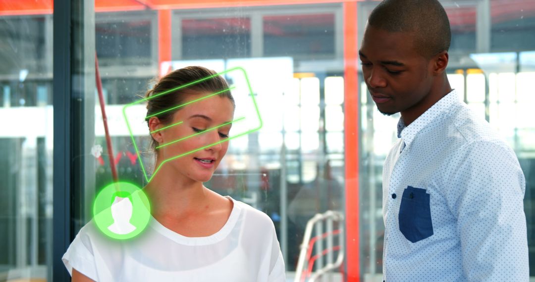 Diverse Colleagues Discussing Ideas with Digital Interface in Office