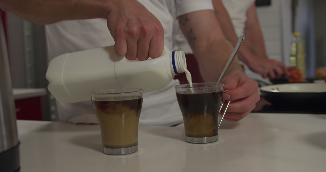 Couple Preparing Iced Coffee Together in Modern Kitchen - Free Images, Stock Photos and Pictures on Pikwizard.com