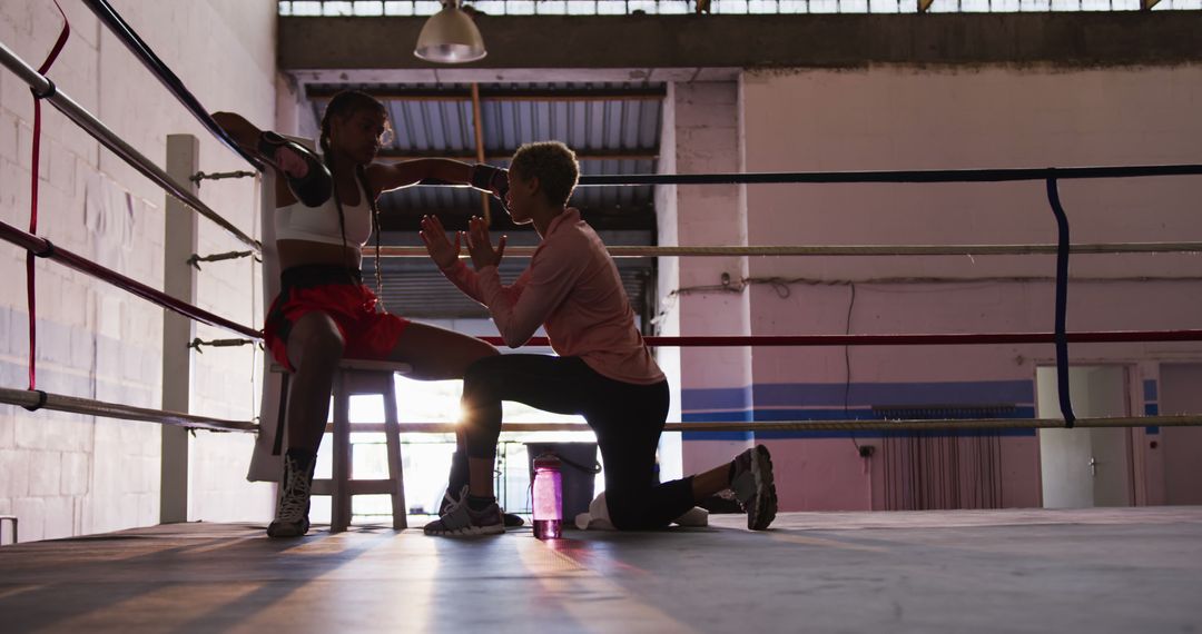 Boxer Taking Rest in Corner with Coach in Boxing Gym - Free Images, Stock Photos and Pictures on Pikwizard.com