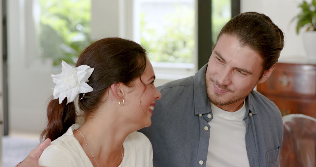 Smiling Couple Enjoys Lounge Chair in Relaxing Gathering Spot
