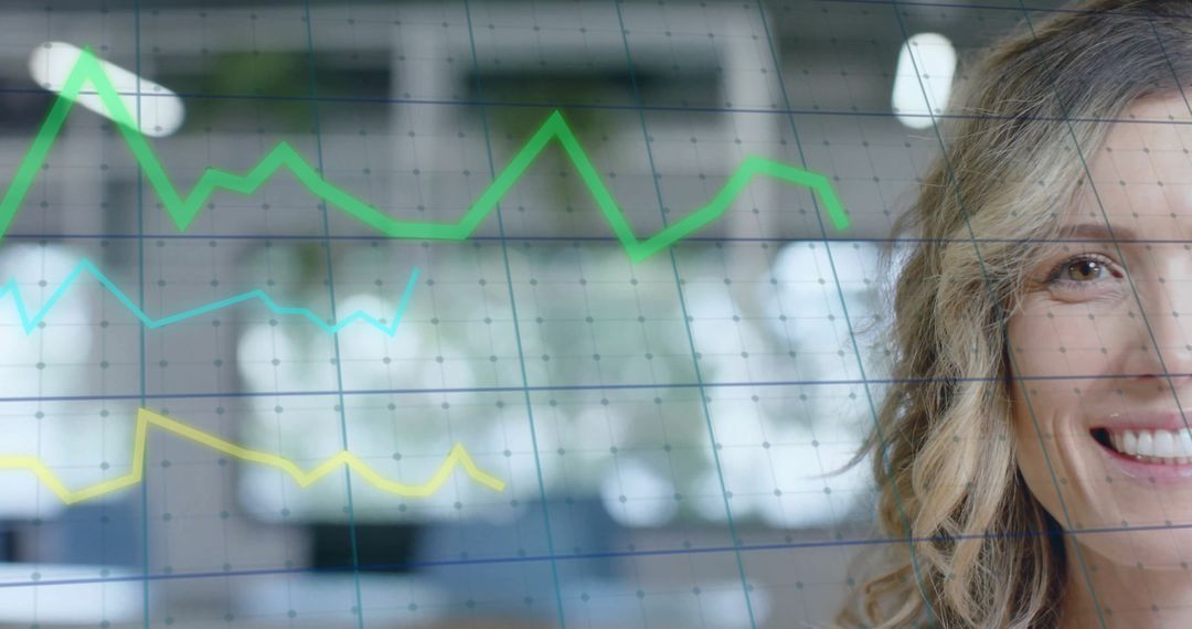 Businesswoman Analyzing Financial Data Trends with Graphs
