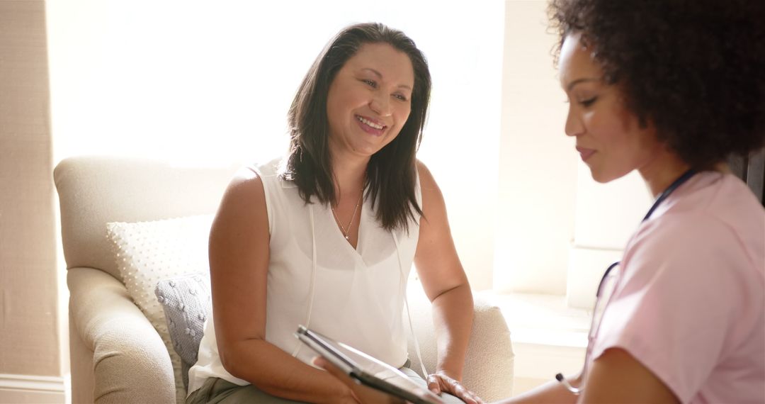 Nurse Discussing Medical Results with Patient Using Tablet Technology