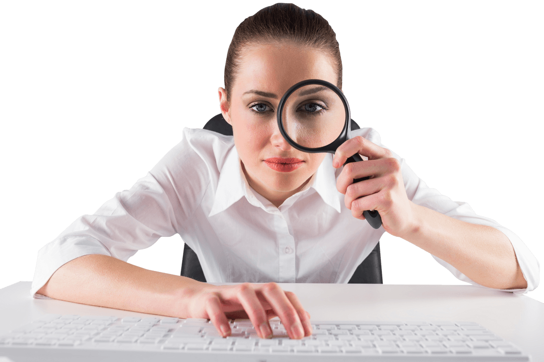 Businesswoman Examining Through Magnifying Glass at Transparent Workspace