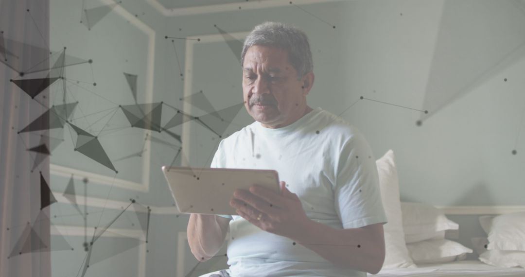 Senior Man Engaging with Digital Network on Tablet