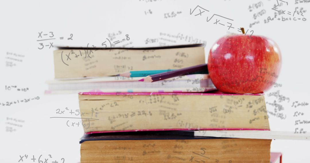 Education Concept: Books, Apple, Formulas Symbolizing Learning