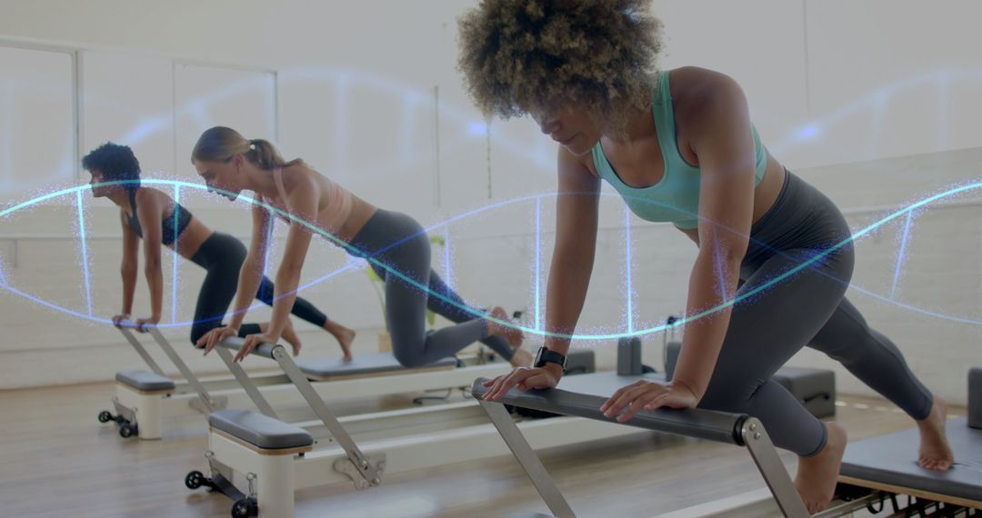 Diverse Women in Pilates Studio on Reformer Machines