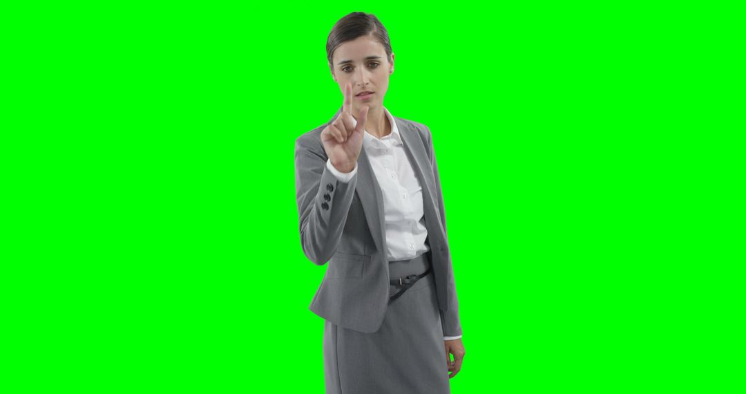 Businesswoman Interacting with Virtual Interface Concept on Green Screen - Free Images, Stock Photos and Pictures on Pikwizard.com