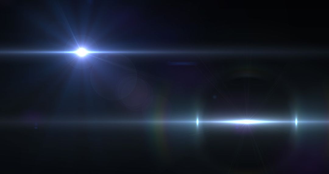 Bright Lens Flares Over Dark Background with Dynamic Movement