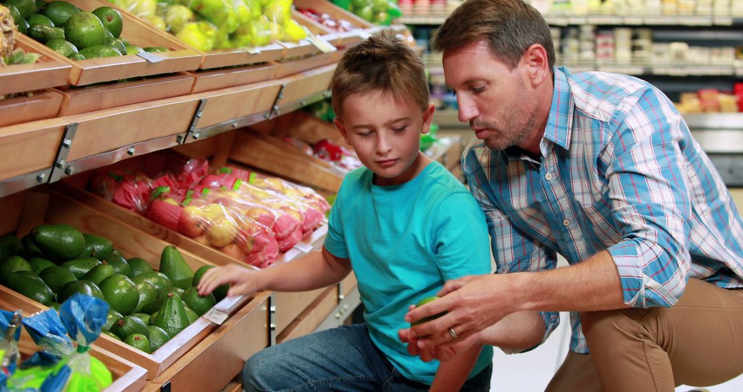 Father and Son Shopping for Fresh Produce in Grocery Store - Free Images, Stock Photos and Pictures on Pikwizard.com