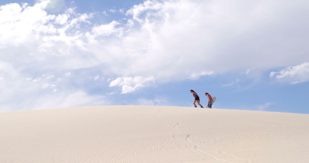 Couple Sand Dune Hiking Adventure Under Clear Sky