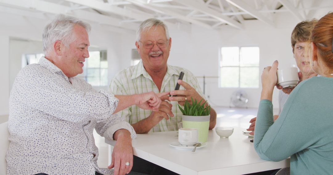 Senior Friends Enjoying Coffee and Laughing Together - Free Images, Stock Photos and Pictures on Pikwizard.com