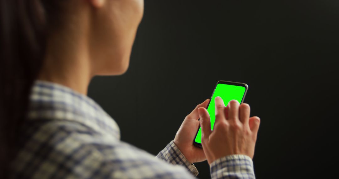 Woman Using Smartphone with Green Screen - Free Images, Stock Photos and Pictures on Pikwizard.com