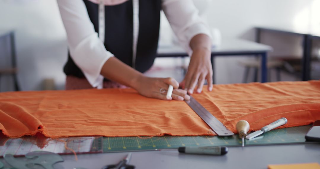 Fashion Designer Measuring Fabric in Studio - Free Images, Stock Photos and Pictures on Pikwizard.com