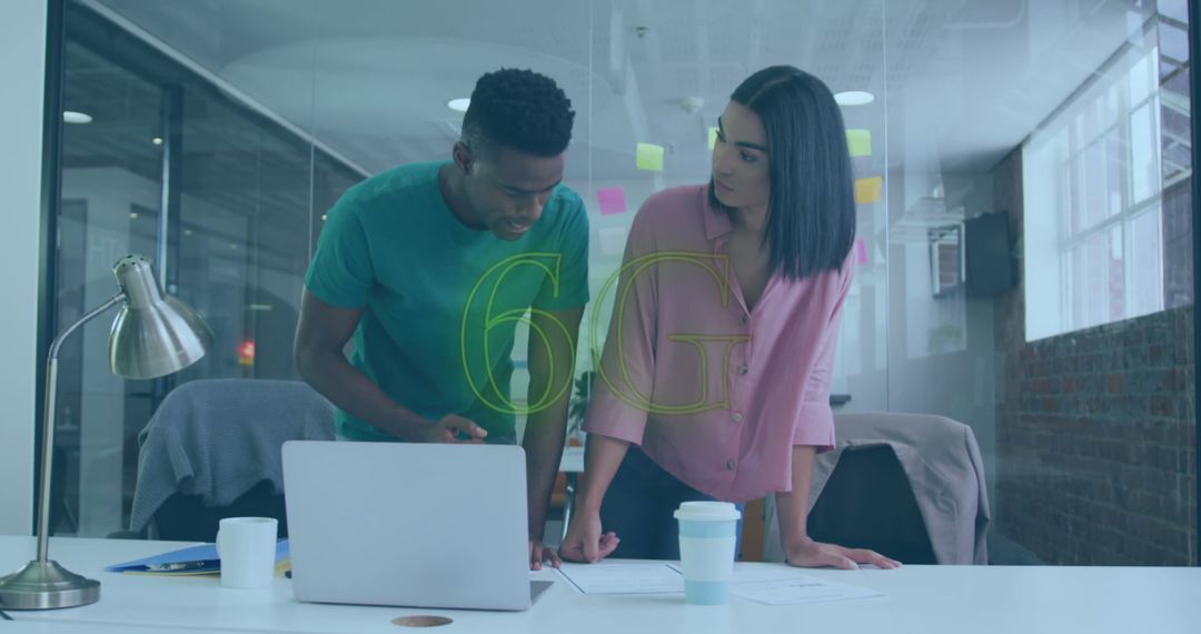 Colleagues Collaborating on 6G Innovation in Modern Office Space