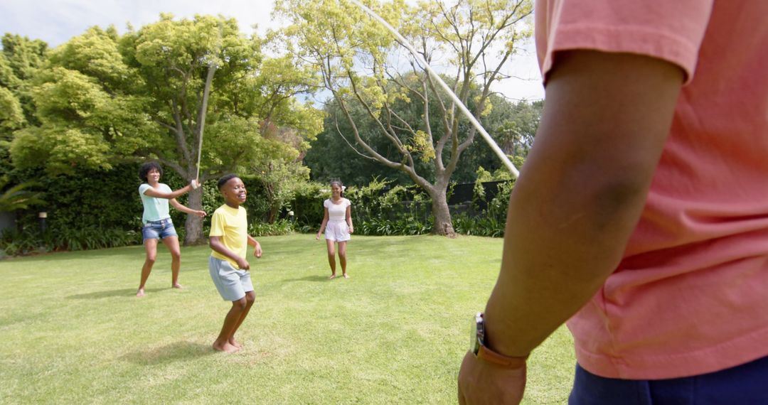 Happy Family Skipping in Lush Garden Sunshine