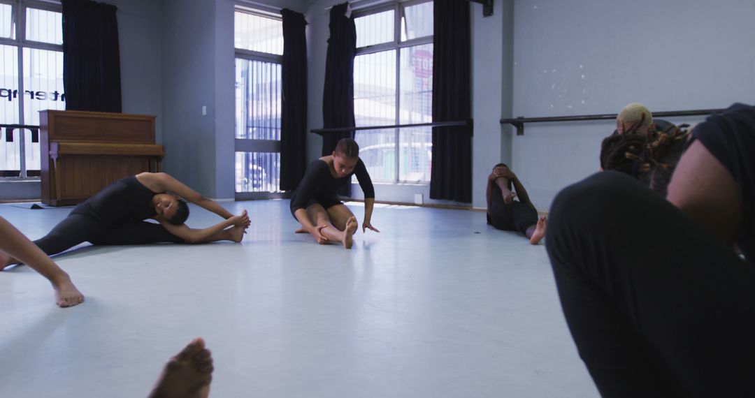 Group of Diverse Adults Stretching During Dance Class in Studio - Free Images, Stock Photos and Pictures on Pikwizard.com