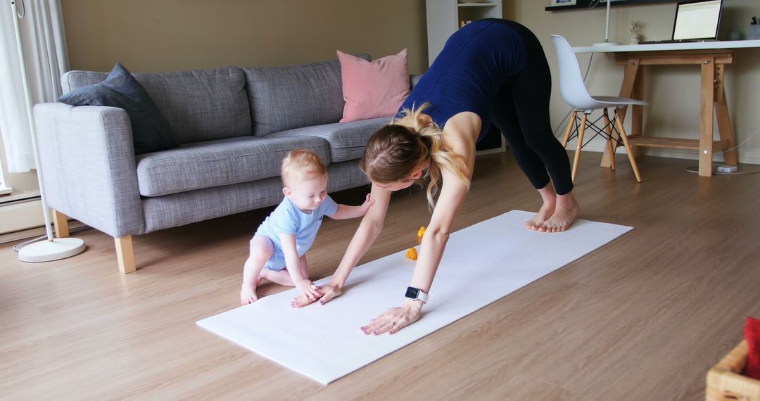 Mother and Baby Enjoying a Playful Yoga Session at Home - Free Images, Stock Photos and Pictures on Pikwizard.com