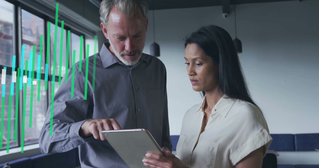Business Colleagues Analyzing Data on Tablet