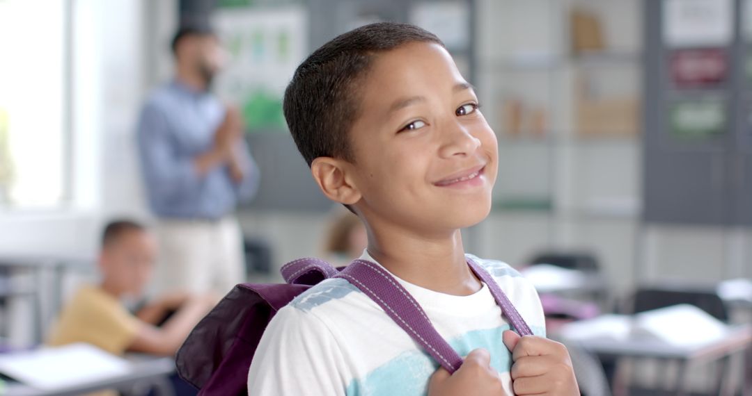 Smiling Schoolboy in Classroom with Backpack Ready for Learning