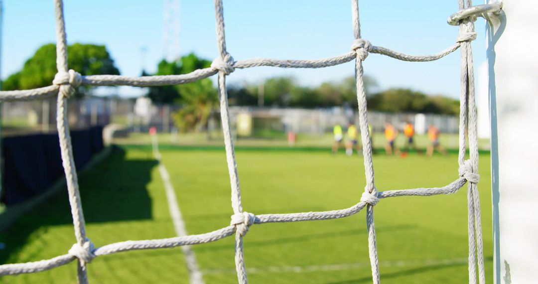 Soccer Goal Focus Highlighting Training Scene on Green Pitch