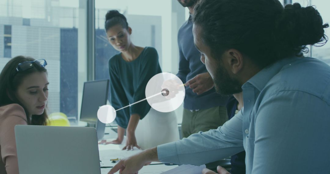 Diverse Team Collaborating Over Reports with Digital Interface