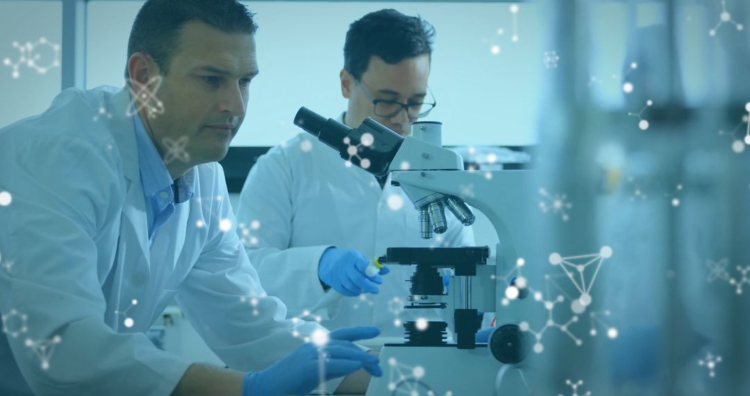 Scientists Engaged in Advanced Microscope Laboratory Research and Analysis