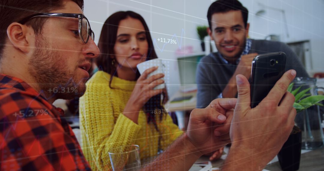 Colleagues Analyzing Data with Smartphone in Office Environment