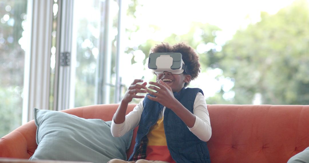 Excited Boy Exploring Virtual Reality on Cozy Couch