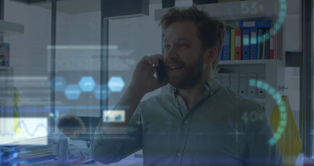 Businessman Analyzing Financial Data on Phone Call in Office