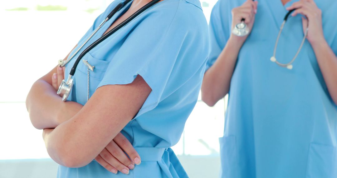 Healthcare professionals standing with stethoscopes in hospital setting - Free Images, Stock Photos and Pictures on Pikwizard.com