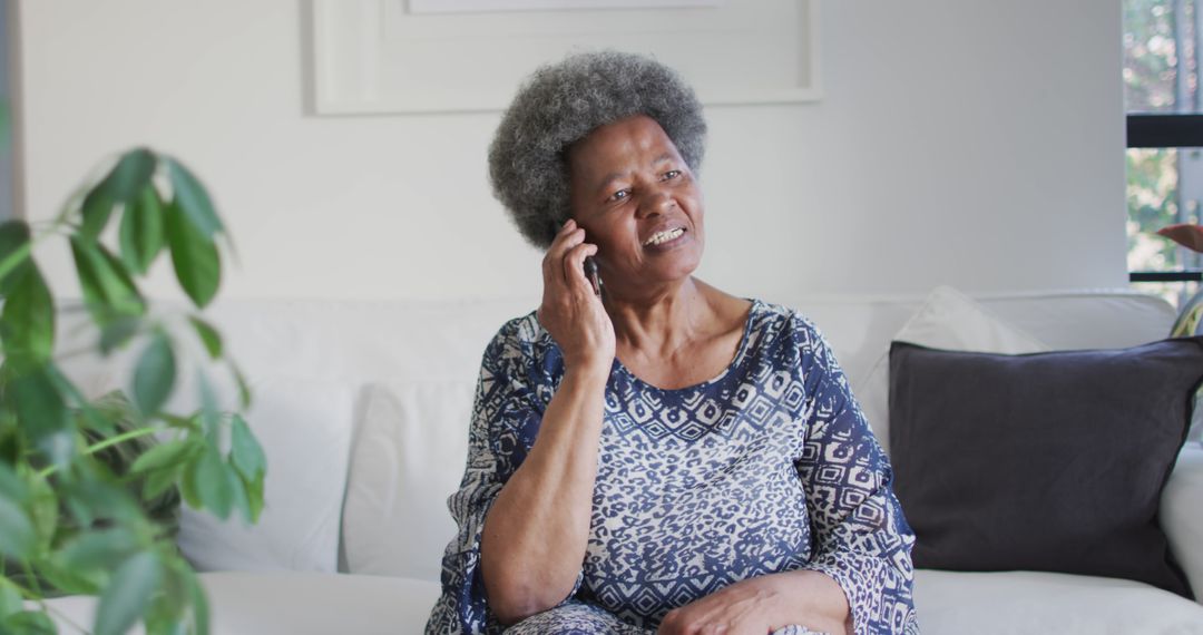 Elderly Woman Having Happy Phone Conversation at Home - Free Images, Stock Photos and Pictures on Pikwizard.com