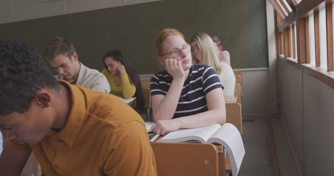 Diverse Students Studying in Classroom with Focused Expressions