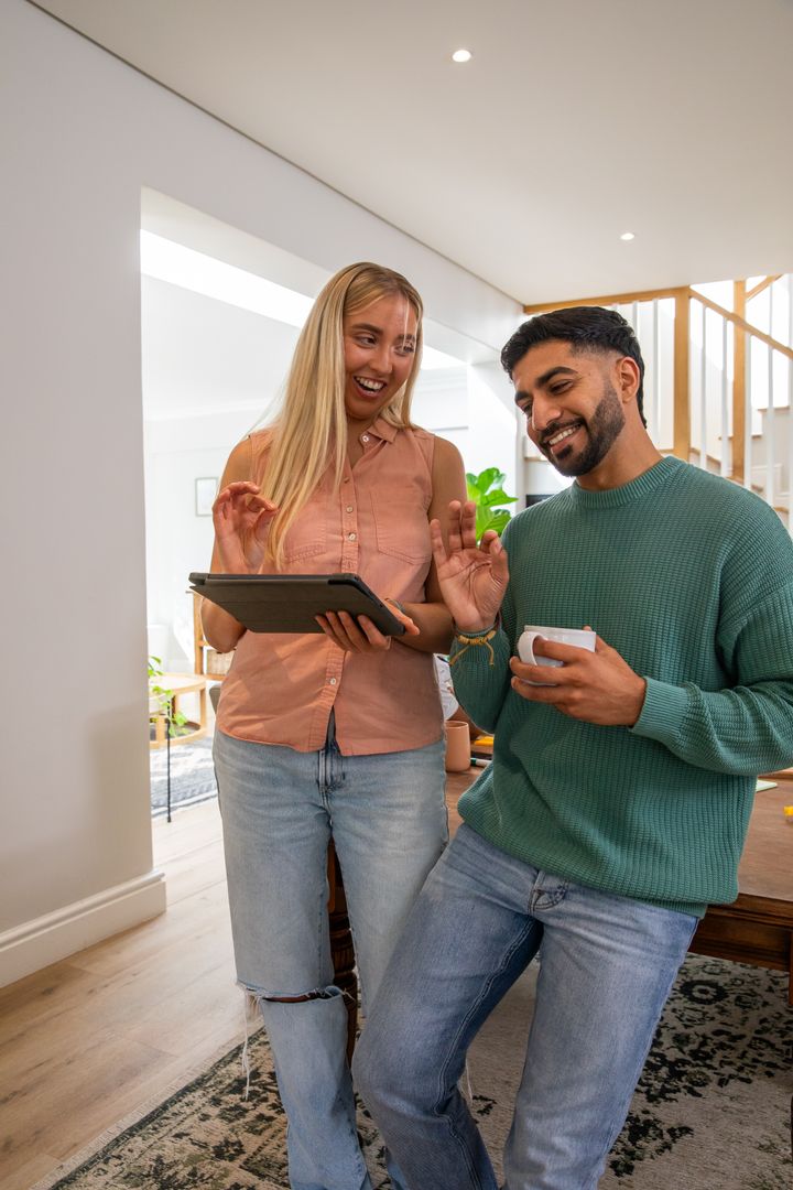 Cheerful Couple Engaging in Video Call at Home
