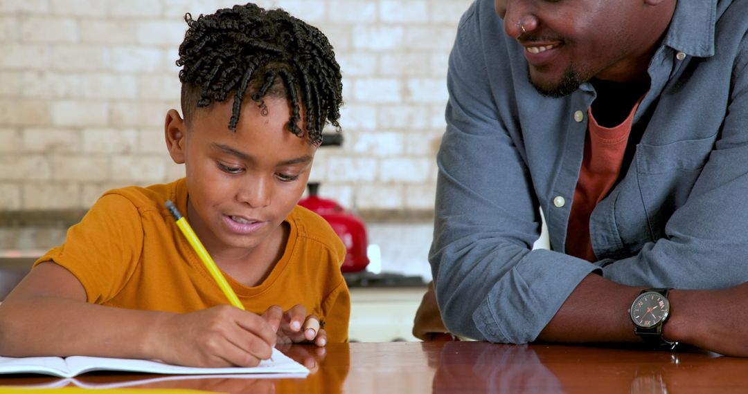 Father Assisting Son with Homework at Home for Education Success