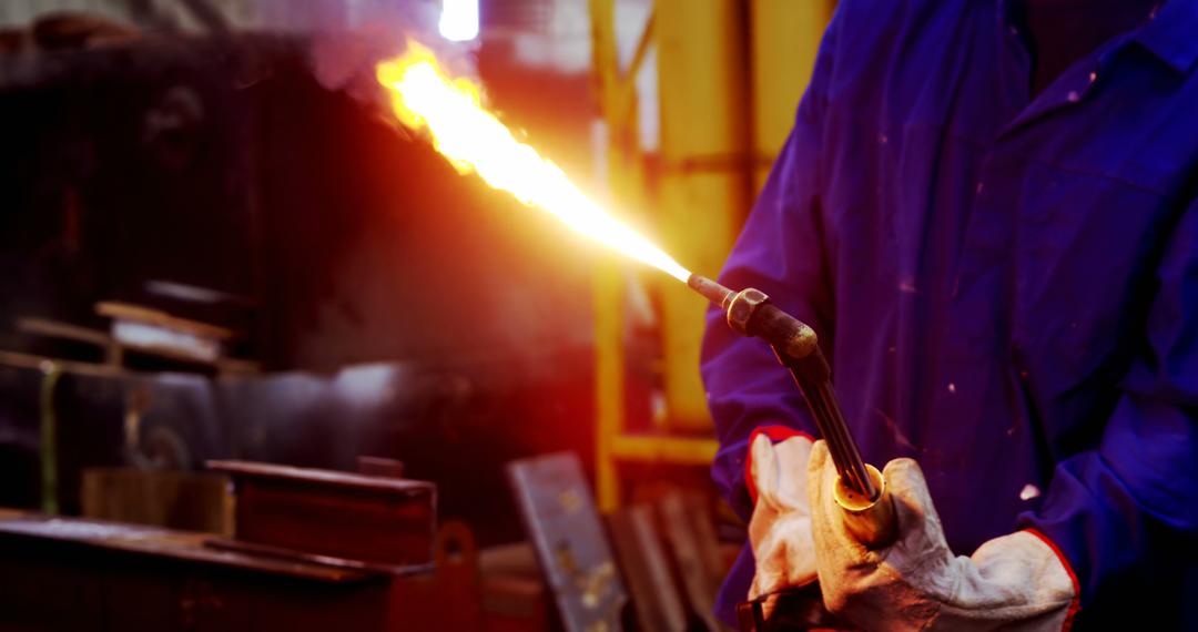 Engineer using gas torch in industrial workshop - Free Images, Stock Photos and Pictures on Pikwizard.com