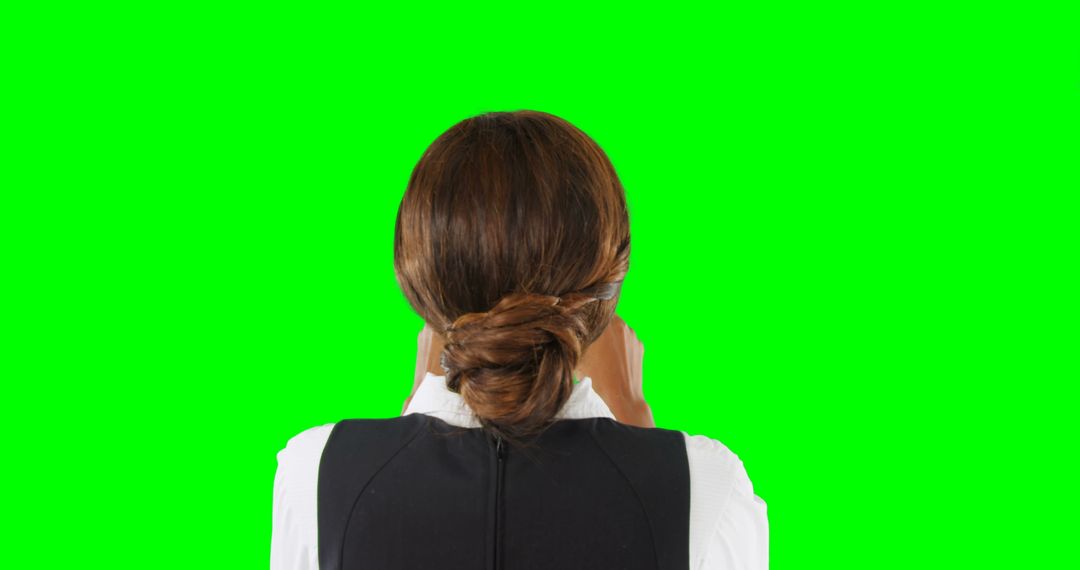 Businesswoman with Neat Bun Facing Green Screen Background - Free Images, Stock Photos and Pictures on Pikwizard.com