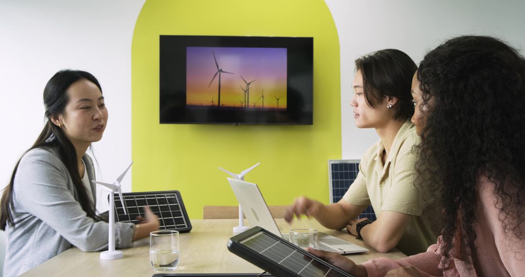 Diverse Team Discussing Renewable Energy Solutions in Office