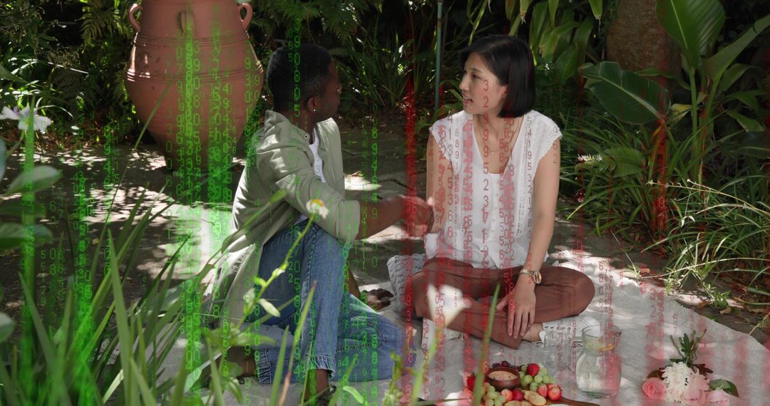 Couple holding hands during romantic picnic in lush garden under dappled shade