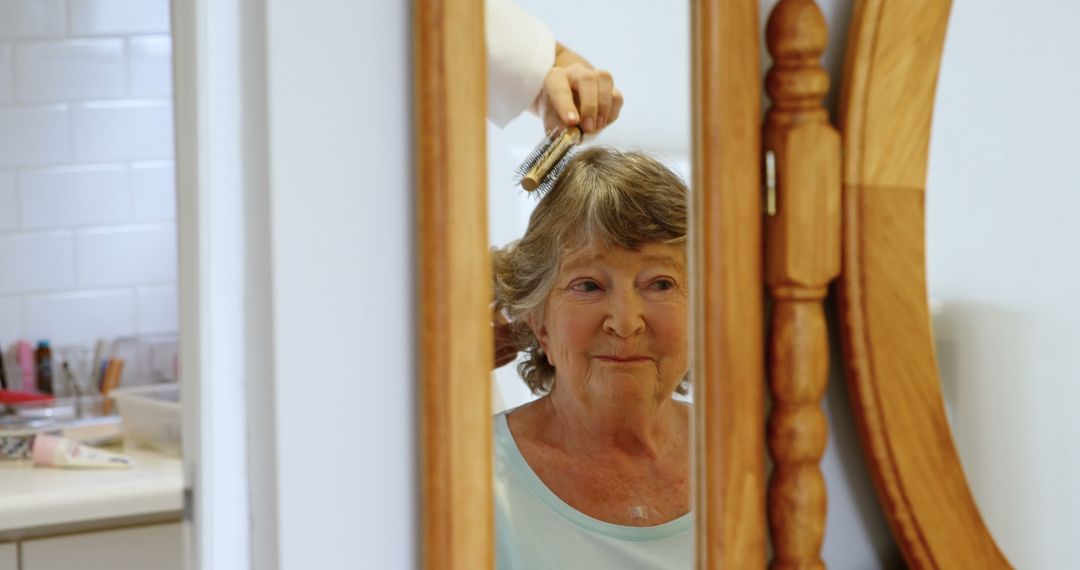 Senior Woman Smiling While Getting Hair Styled in Mirror Reflection - Free Images, Stock Photos and Pictures on Pikwizard.com