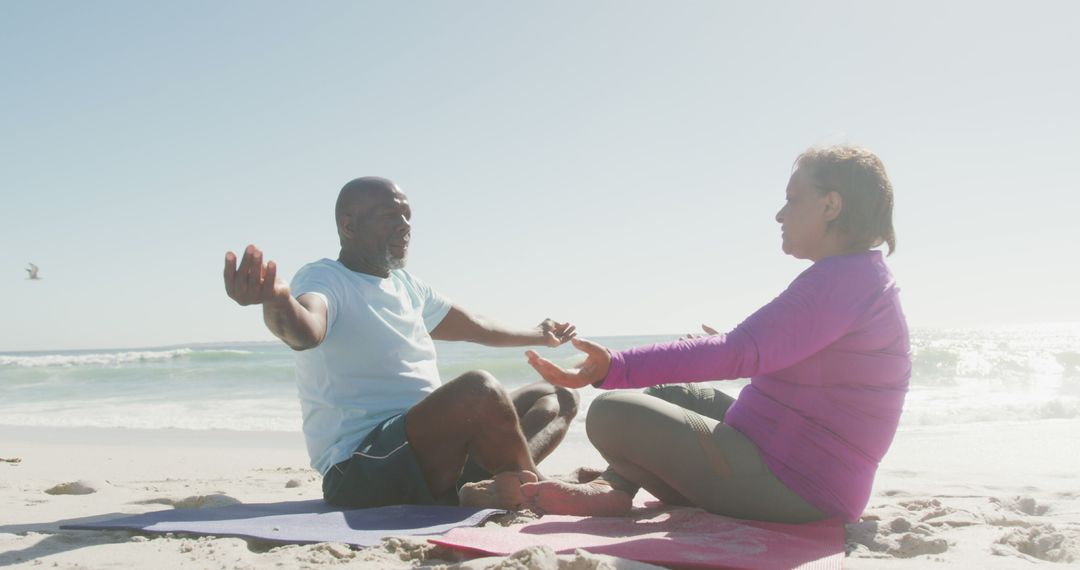 Senior Couple Practicing Yoga on Beach in Morning Sun - Free Images, Stock Photos and Pictures on Pikwizard.com