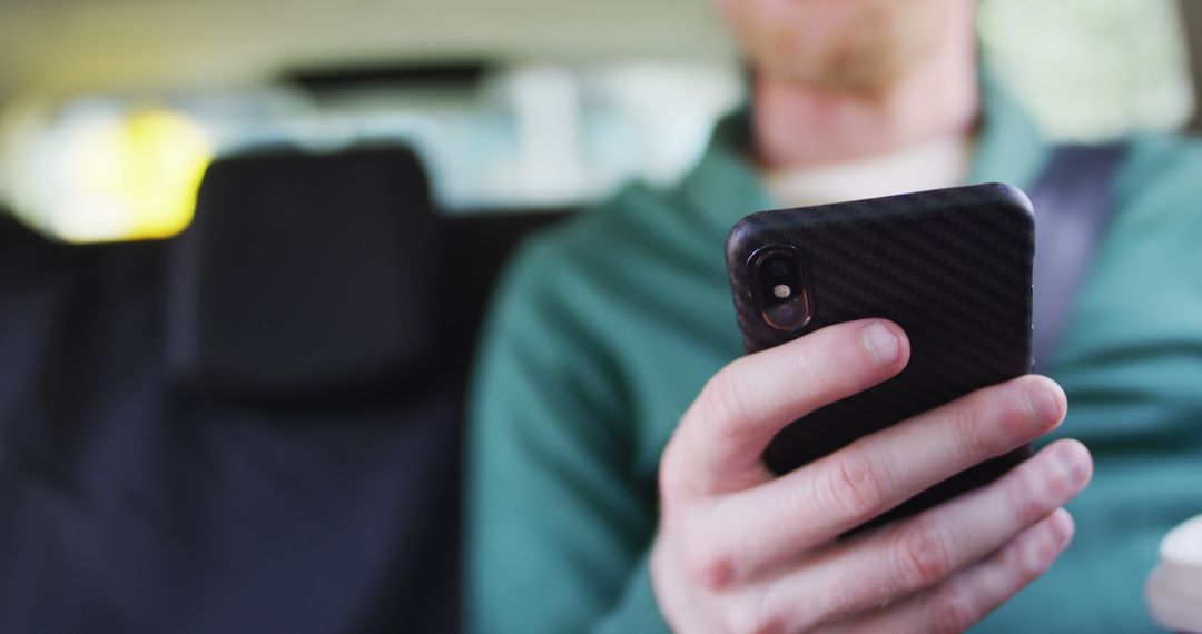 Person Using Smartphone in Car Holding Coffee Cup - Free Images, Stock Photos and Pictures on Pikwizard.com