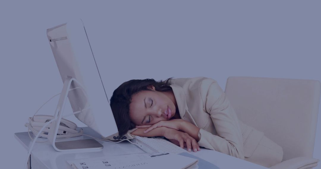 Tired Businesswoman Resting Head on Desk During Work