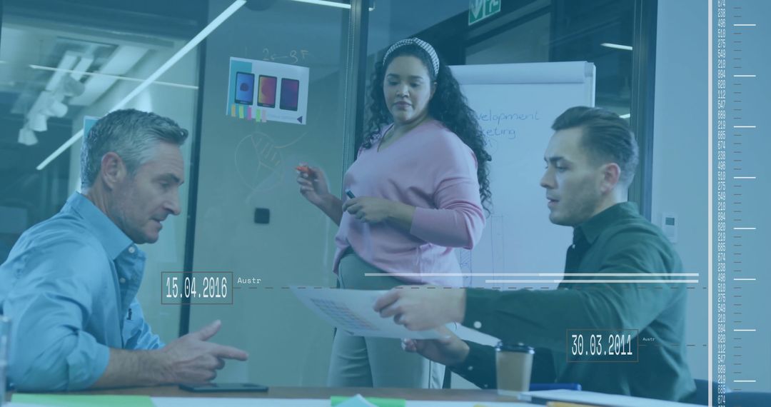 Colleagues Collaborating with Data Interface at Office Meeting