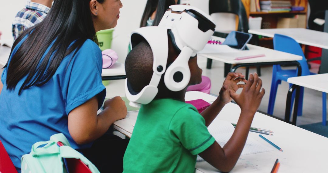 Child Experiencing Virtual Reality in Classroom with Teacher
