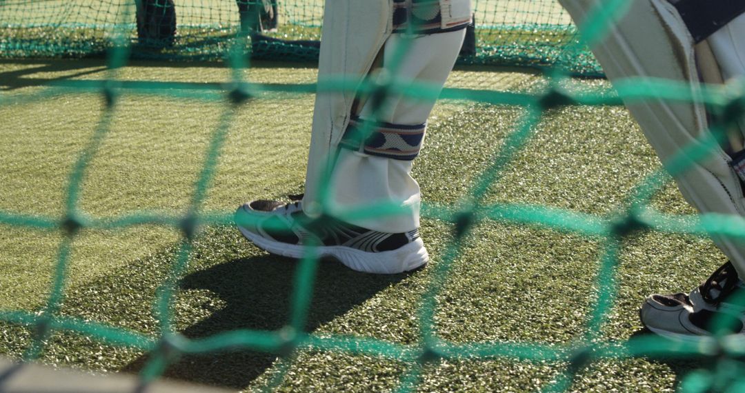 Cricketer Wearing Pads Practicing in Nets - Free Images, Stock Photos and Pictures on Pikwizard.com