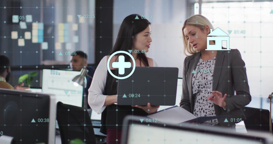 Diverse Female Colleagues Collaborating in Technology-Driven Office