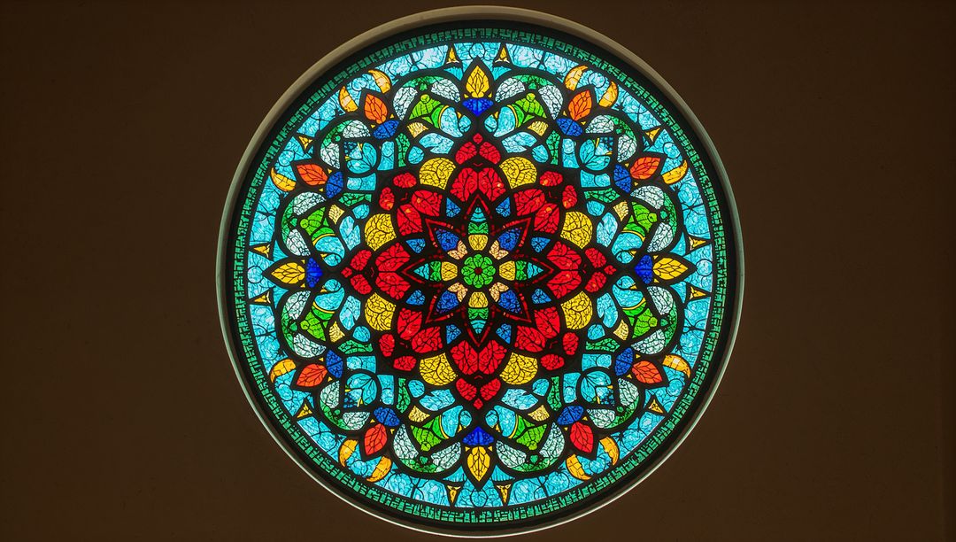 Vibrant Circular Stained Glass Window with Ornate Pattern