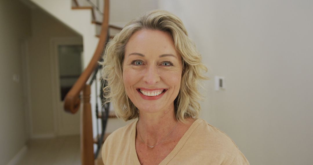Smiling Middle-Aged Caucasian Woman at Home with Relaxed Expression